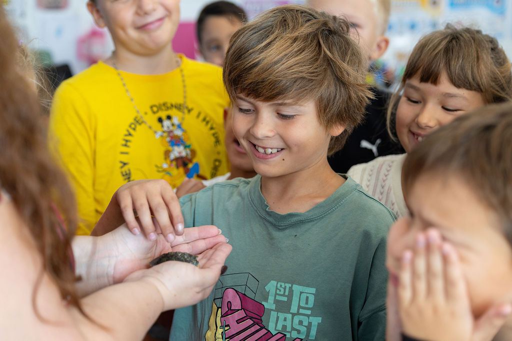Children gathered around a shared classroom activity at Golden Oak.