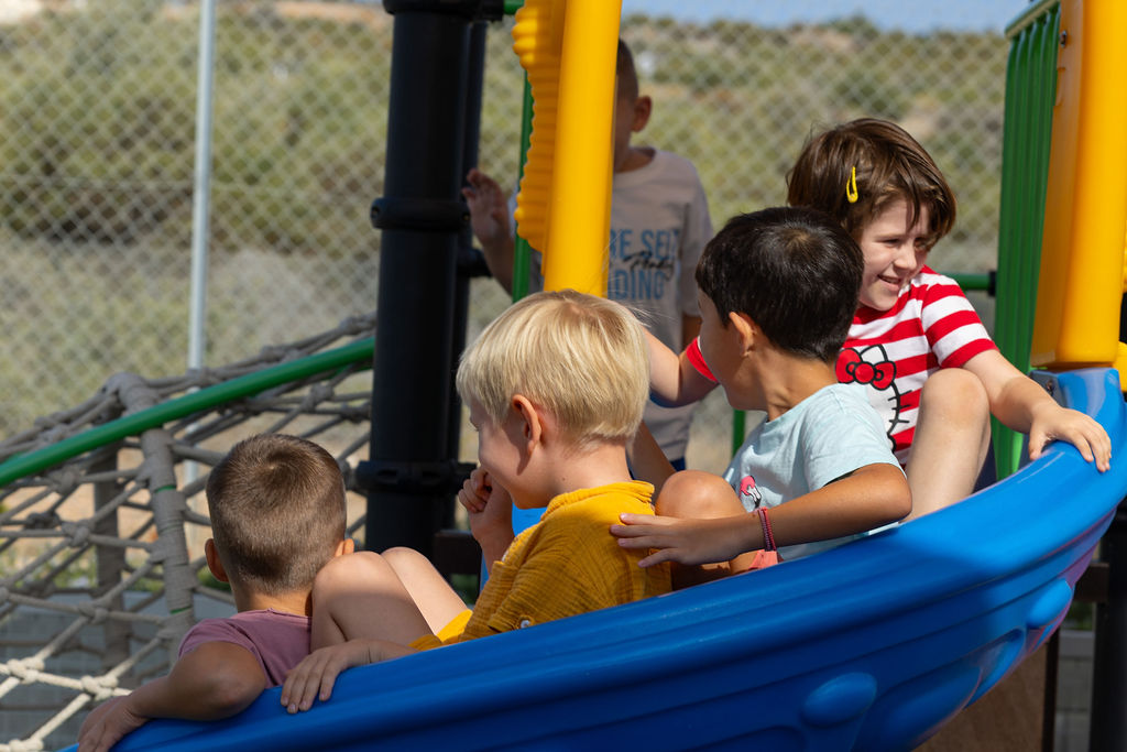 Children playing together outdoors at Golden Oak.