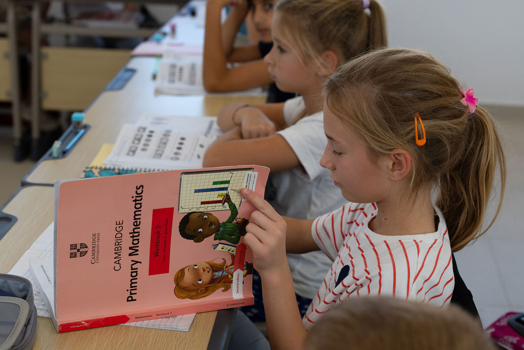 Children reading books together in a Golden Oak classroom.